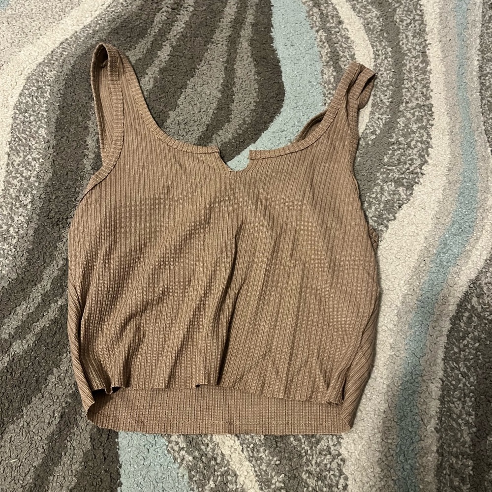 Brown Tank size L but fits like a medium